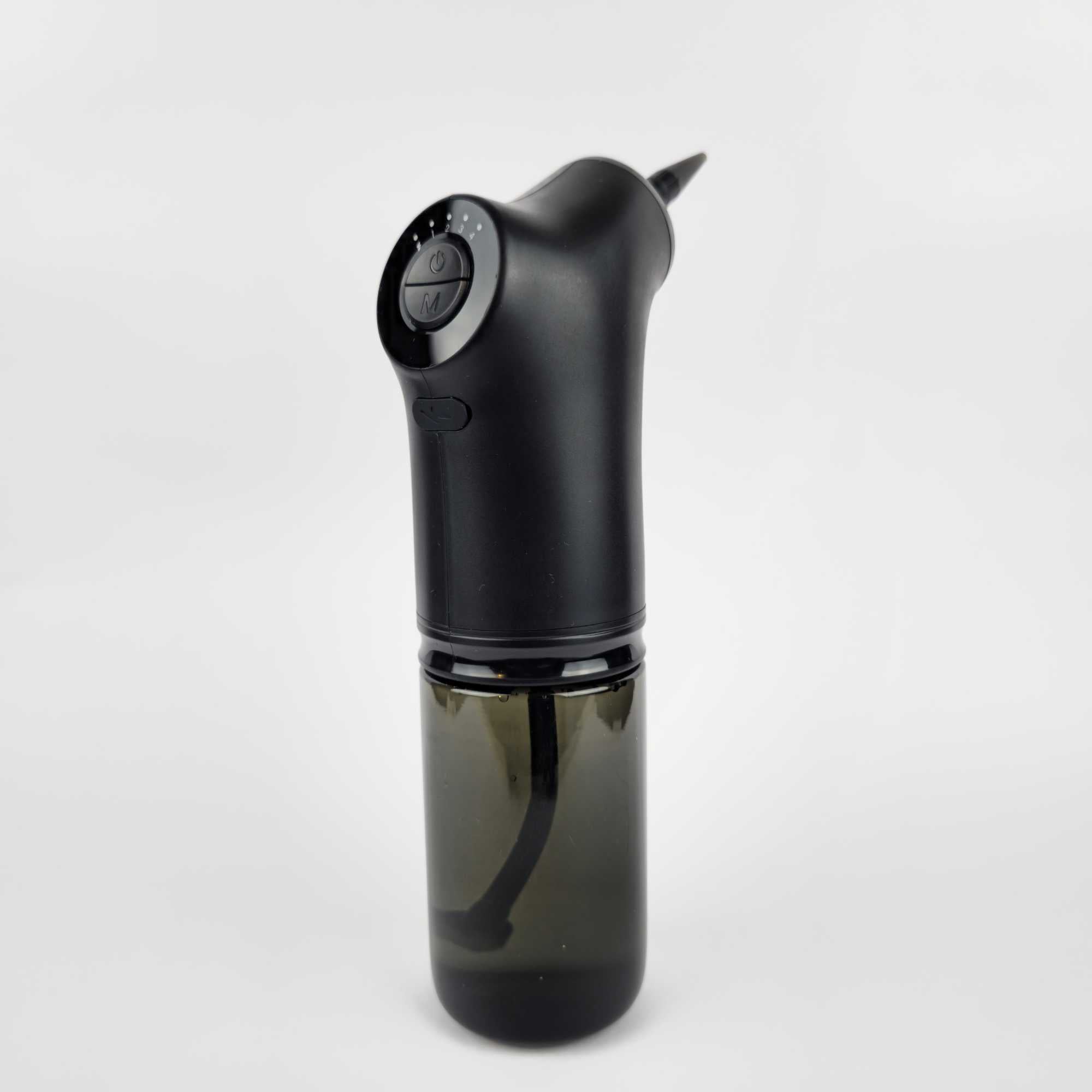 Back view of electric ear wax removal kit showing power button and ergonomic grip.jpg
