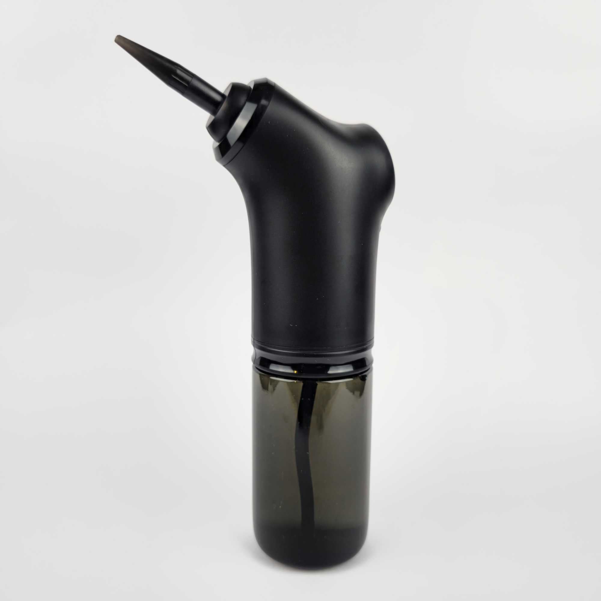 Side view of electric ear wax cleaner with water tank and spray nozzle.jpg